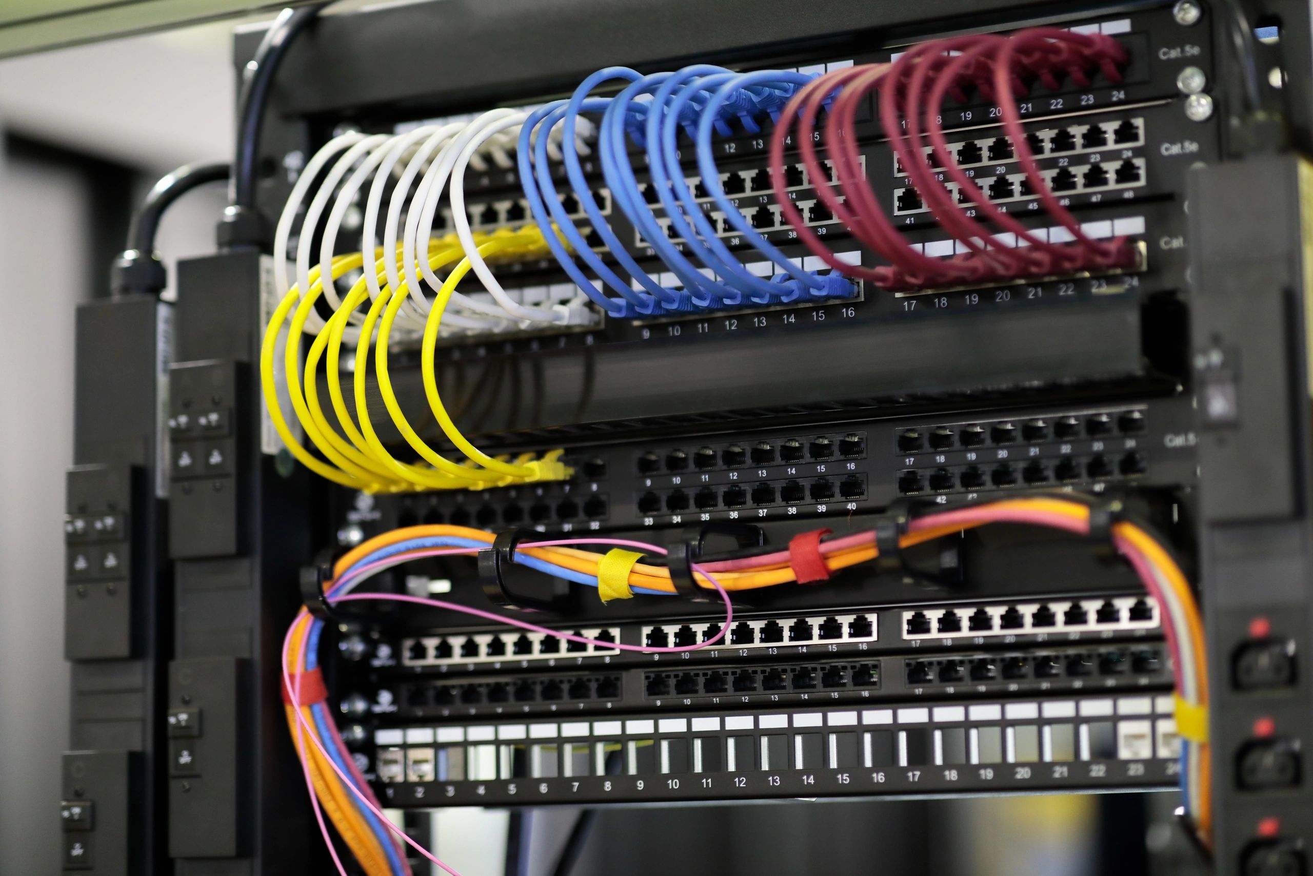 Patch panels and patch cords inside a network rack