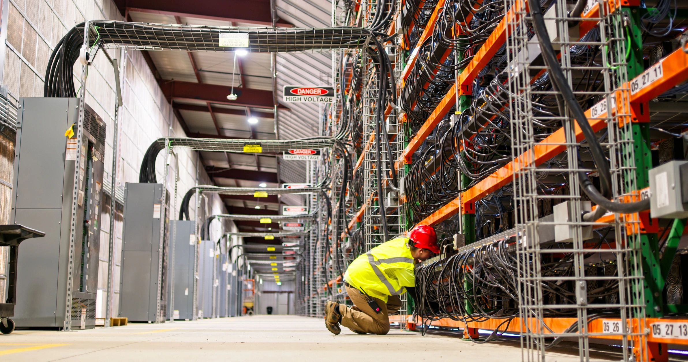 Technician working on network equipment in a data center